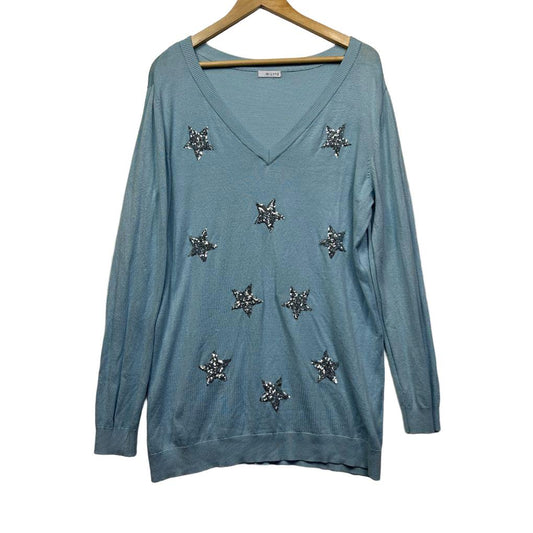 Blue long sleeve top with star embellishments front view
