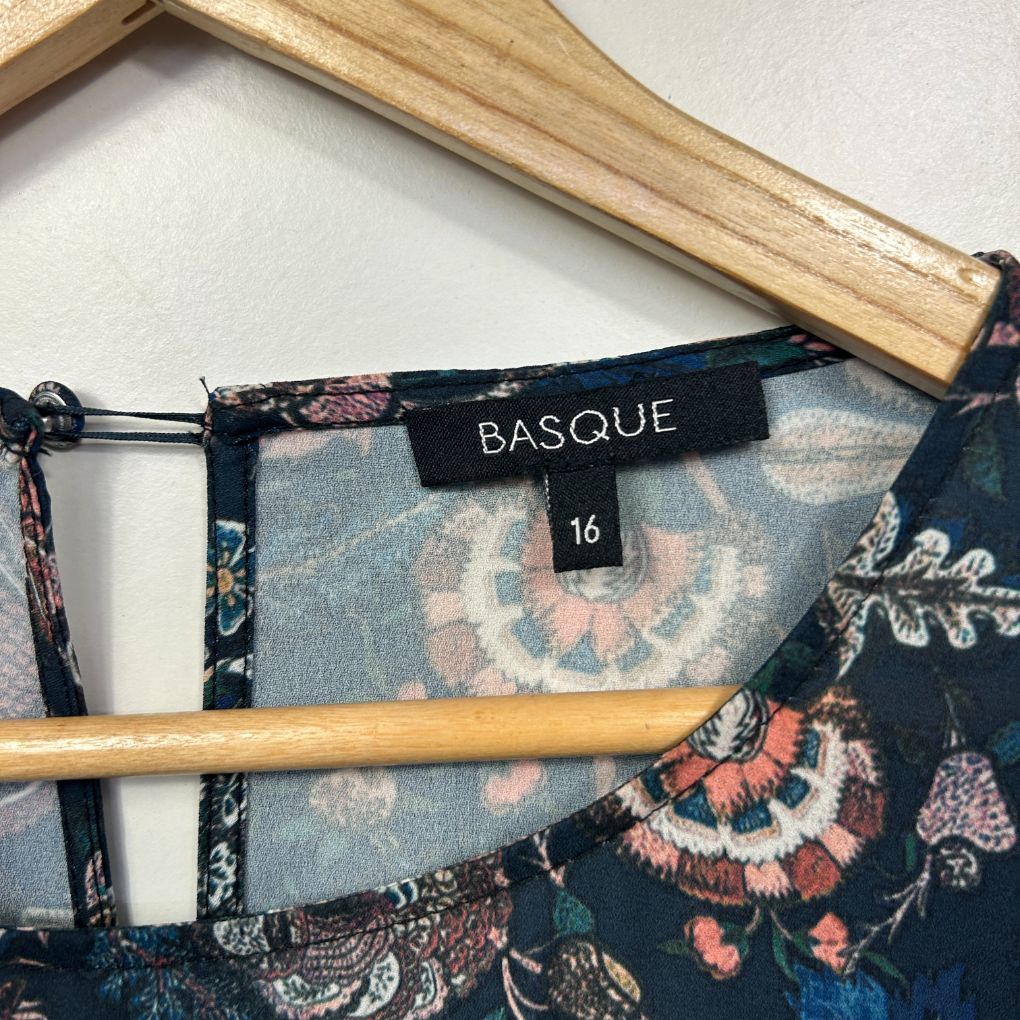 Navy floral dress label and hanger detail view