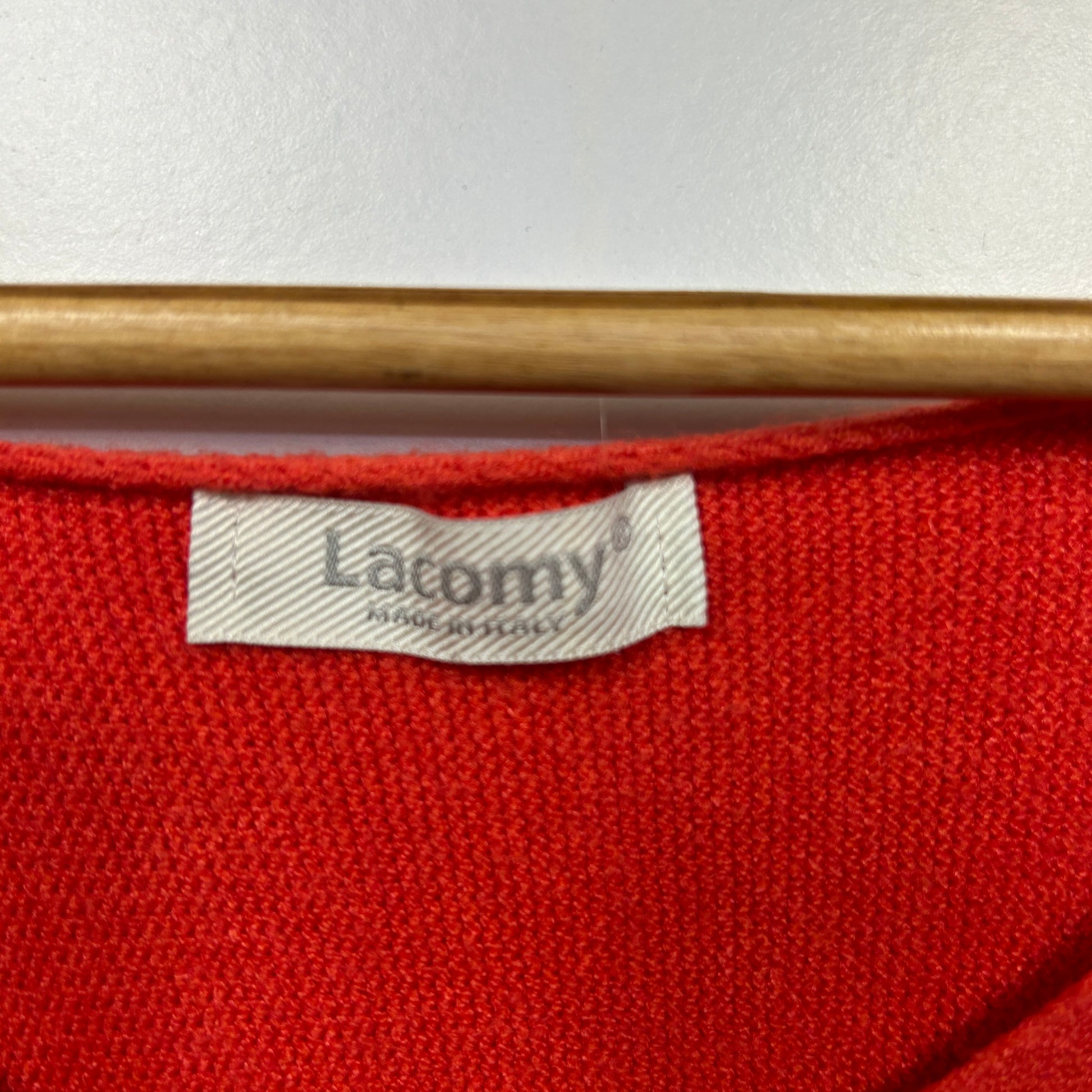 Red knit garment label detail view