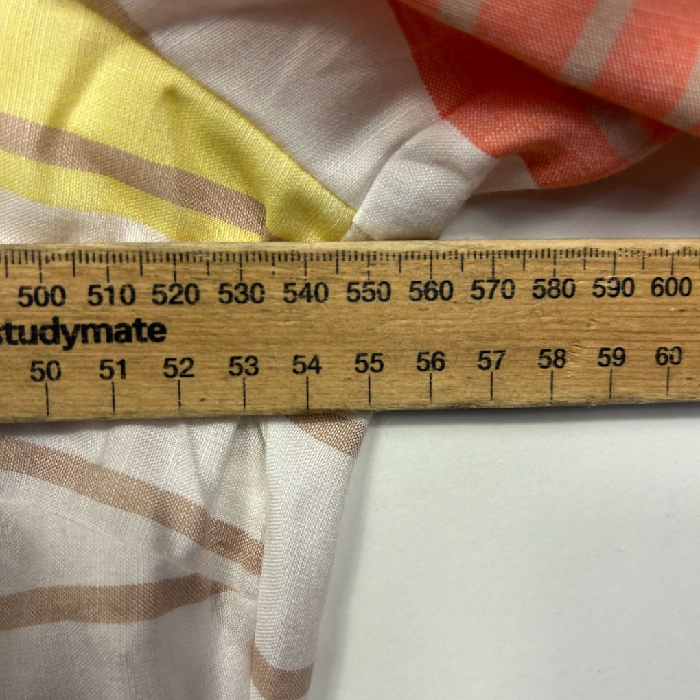Striped fabric detail view with measuring ruler