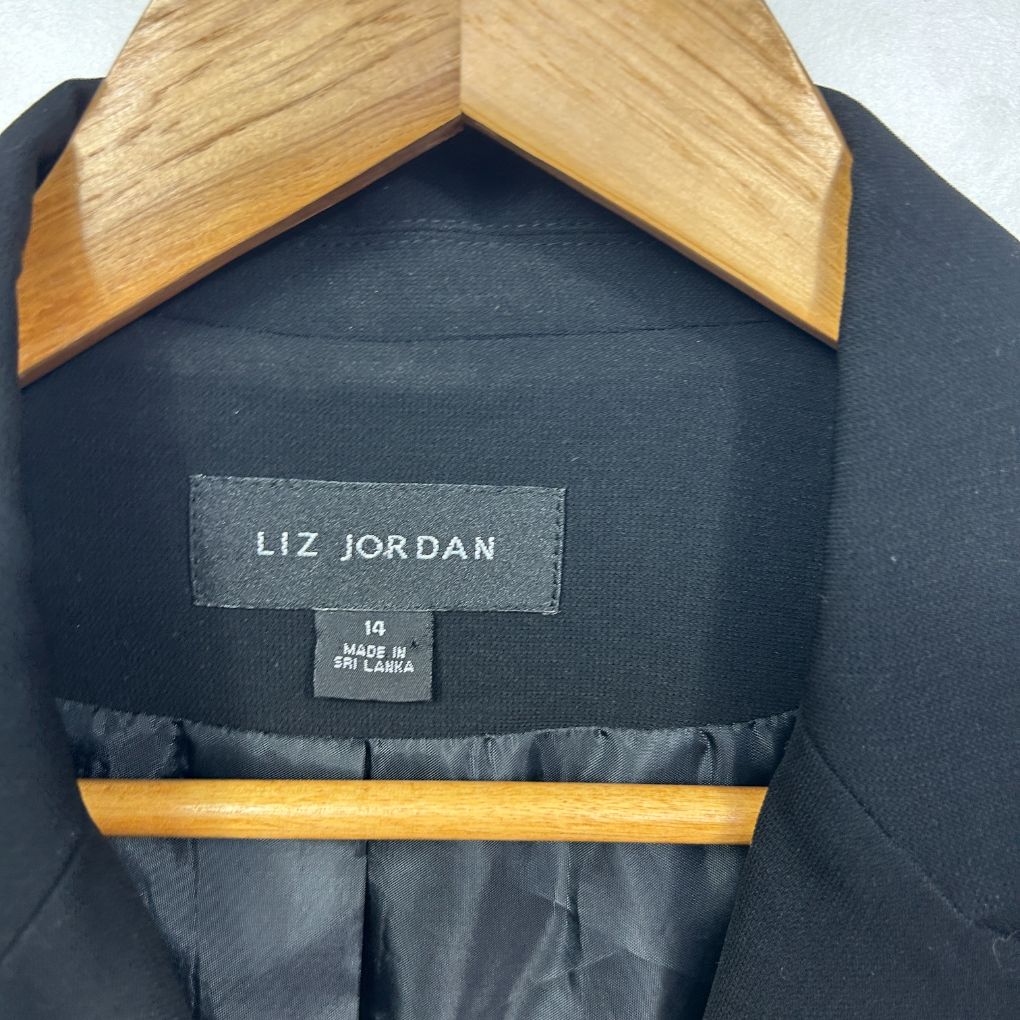 Navy blazer front view on wooden hanger