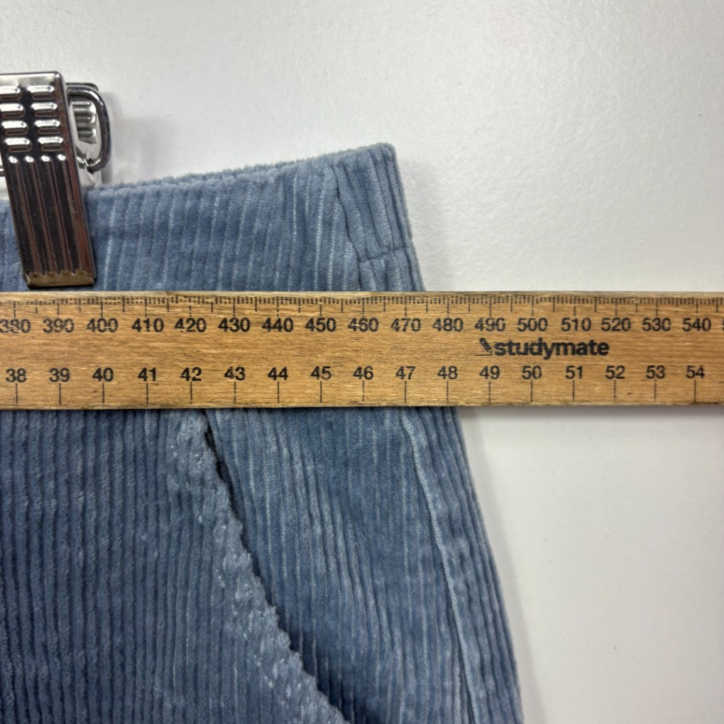 Blue ribbed trousers with measuring tape detail view