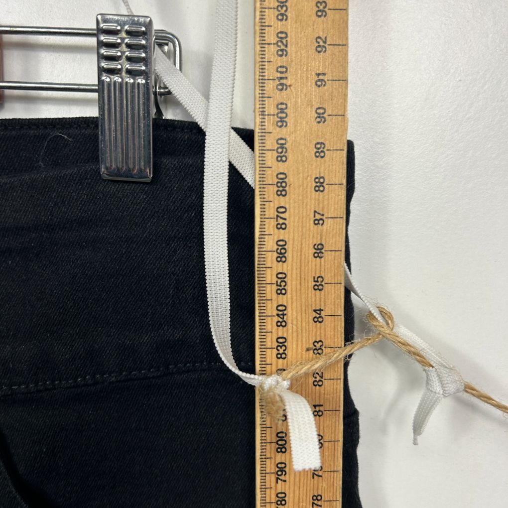 Black shorts front view with measuring tape