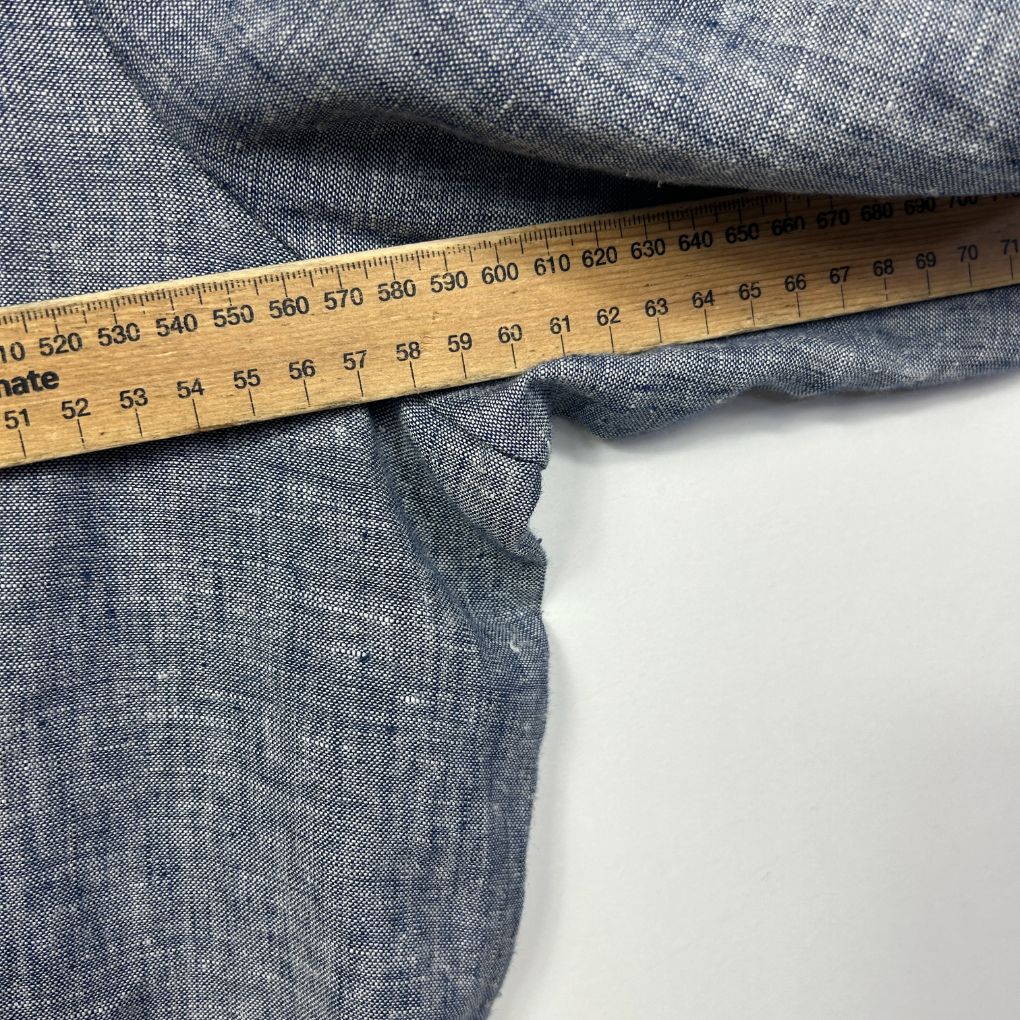 Grey fabric measured with tape measure detail view