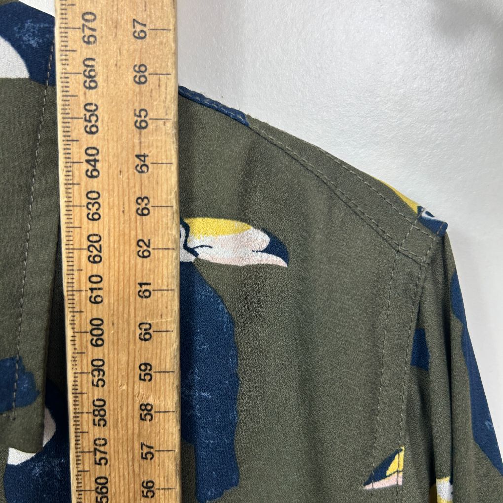Olive green jumper with navy blue and white colour block detail view