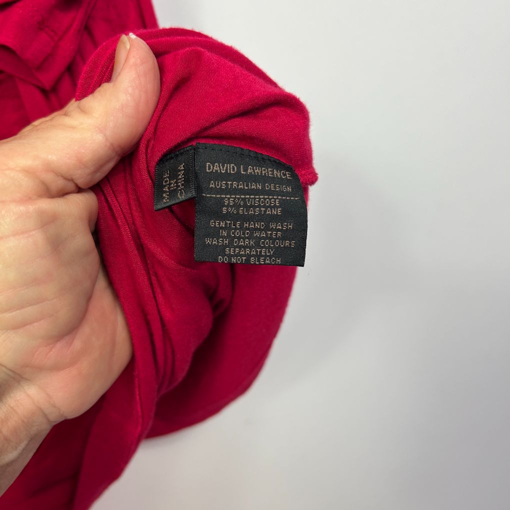 Red garment label detail view