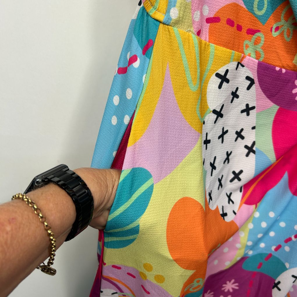 Colorful graphic print dress detail view