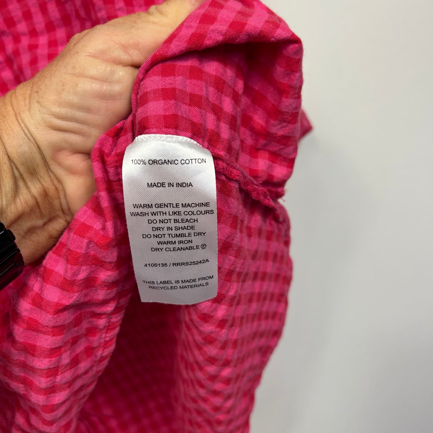 Pink checked shirt label detail view