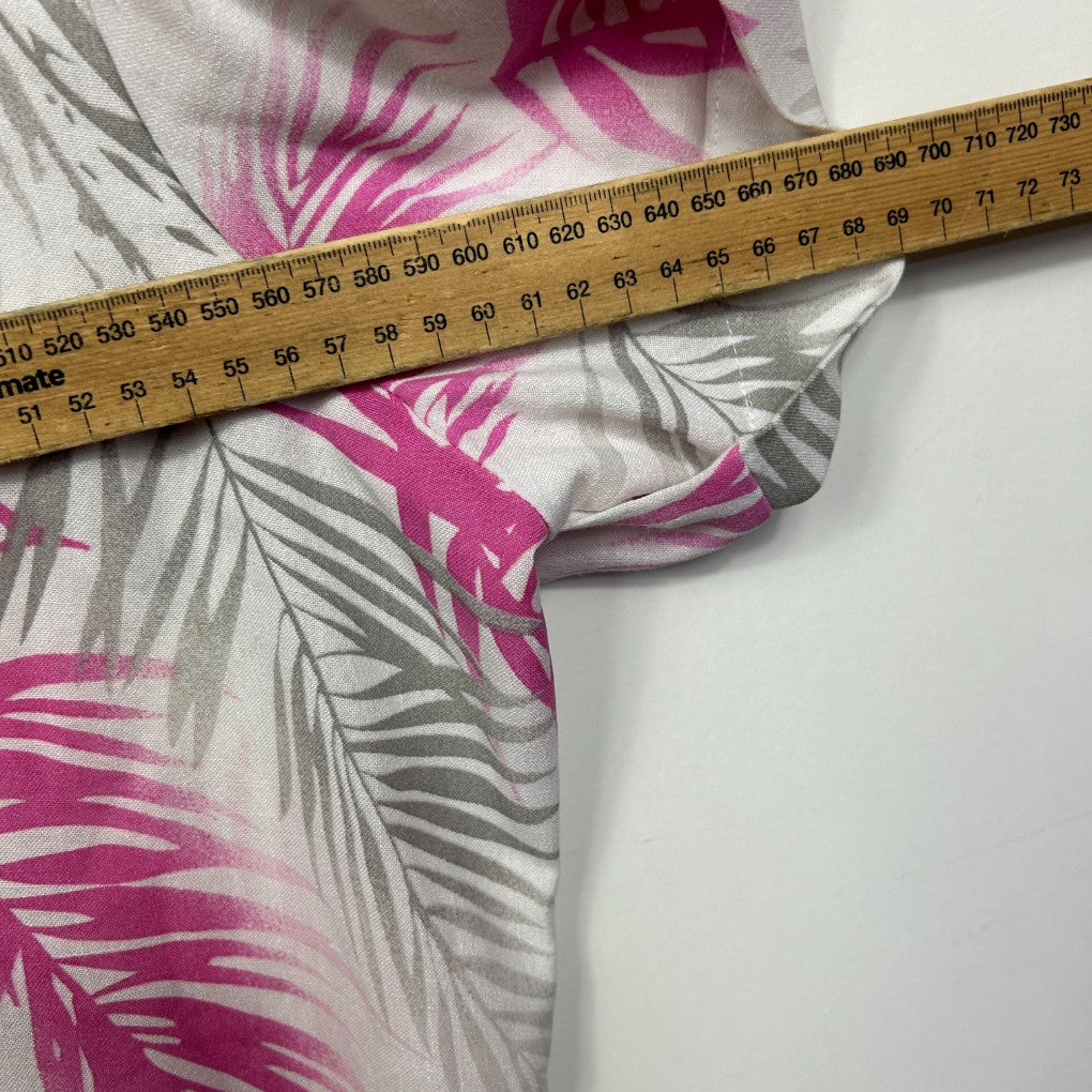 Pink and grey floral fabric detail with measuring tape