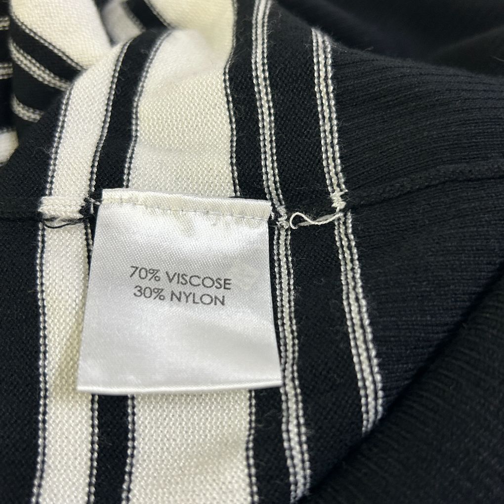 Striped top label detail showing fabric composition