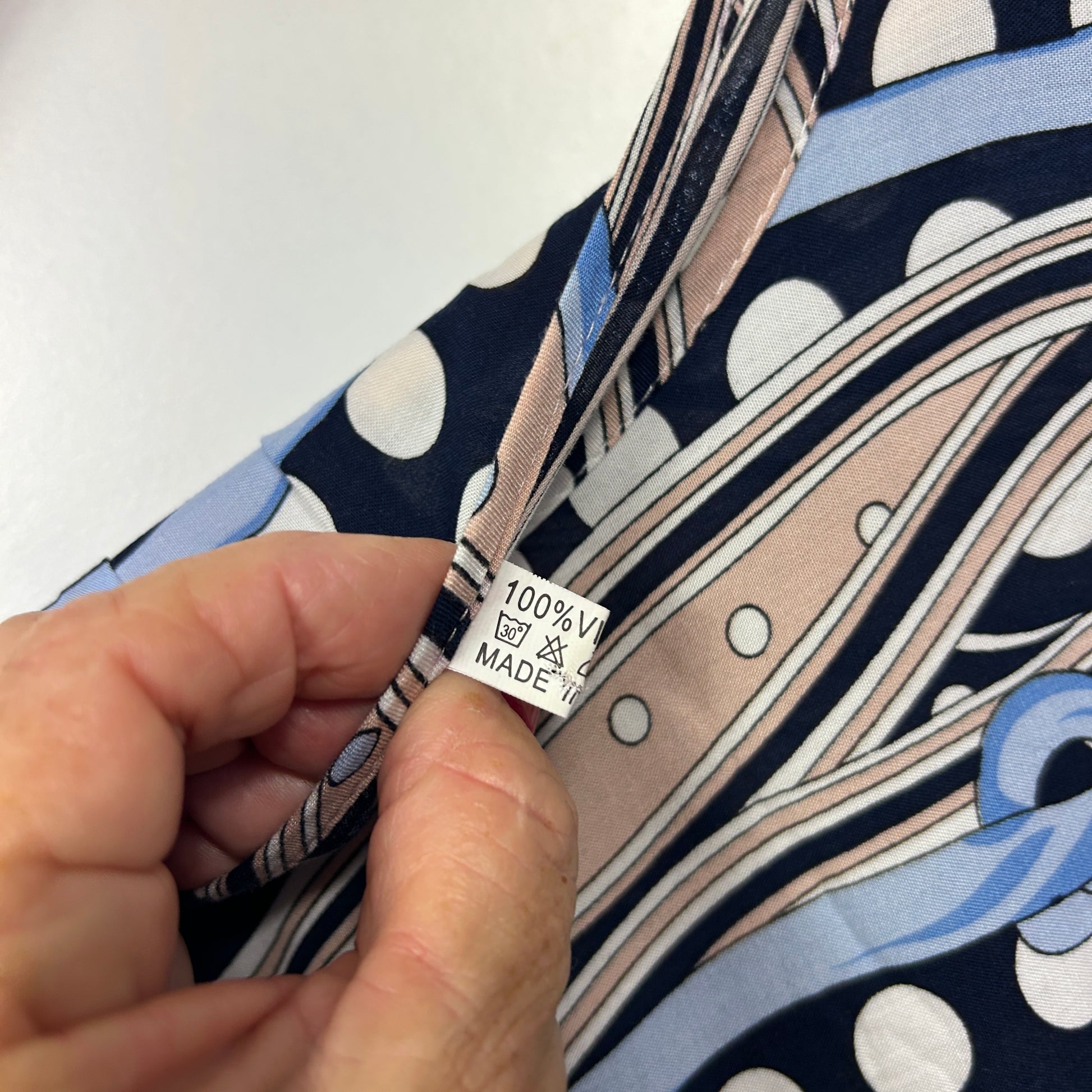 Navy and white striped fabric detail view with label