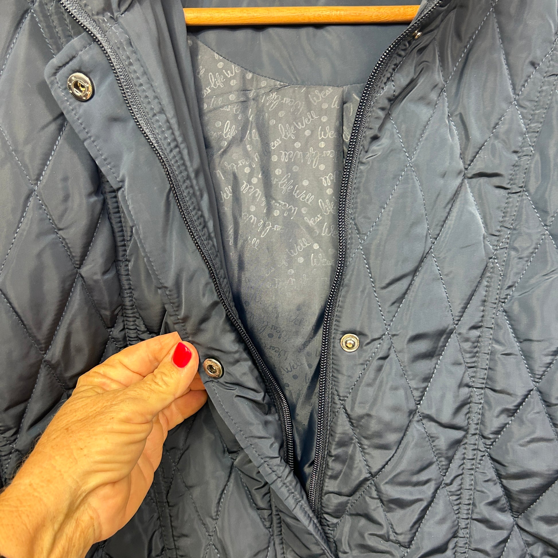 Grey puffer jacket front view with zipper detail