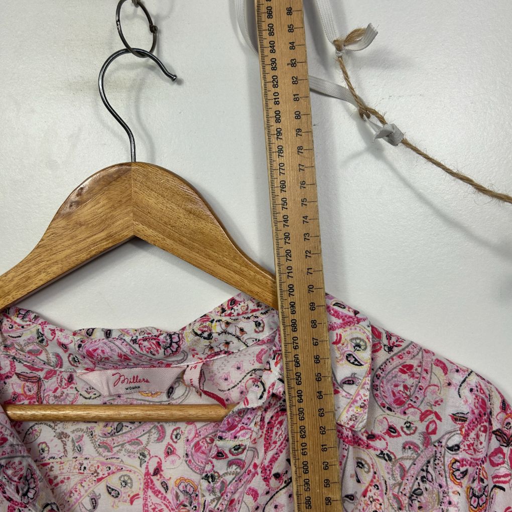 Pink floral top front view on wooden hanger