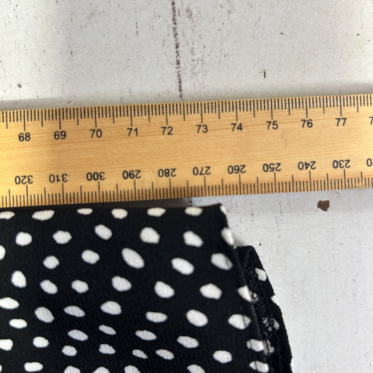 Black and white polka dot fabric detail view