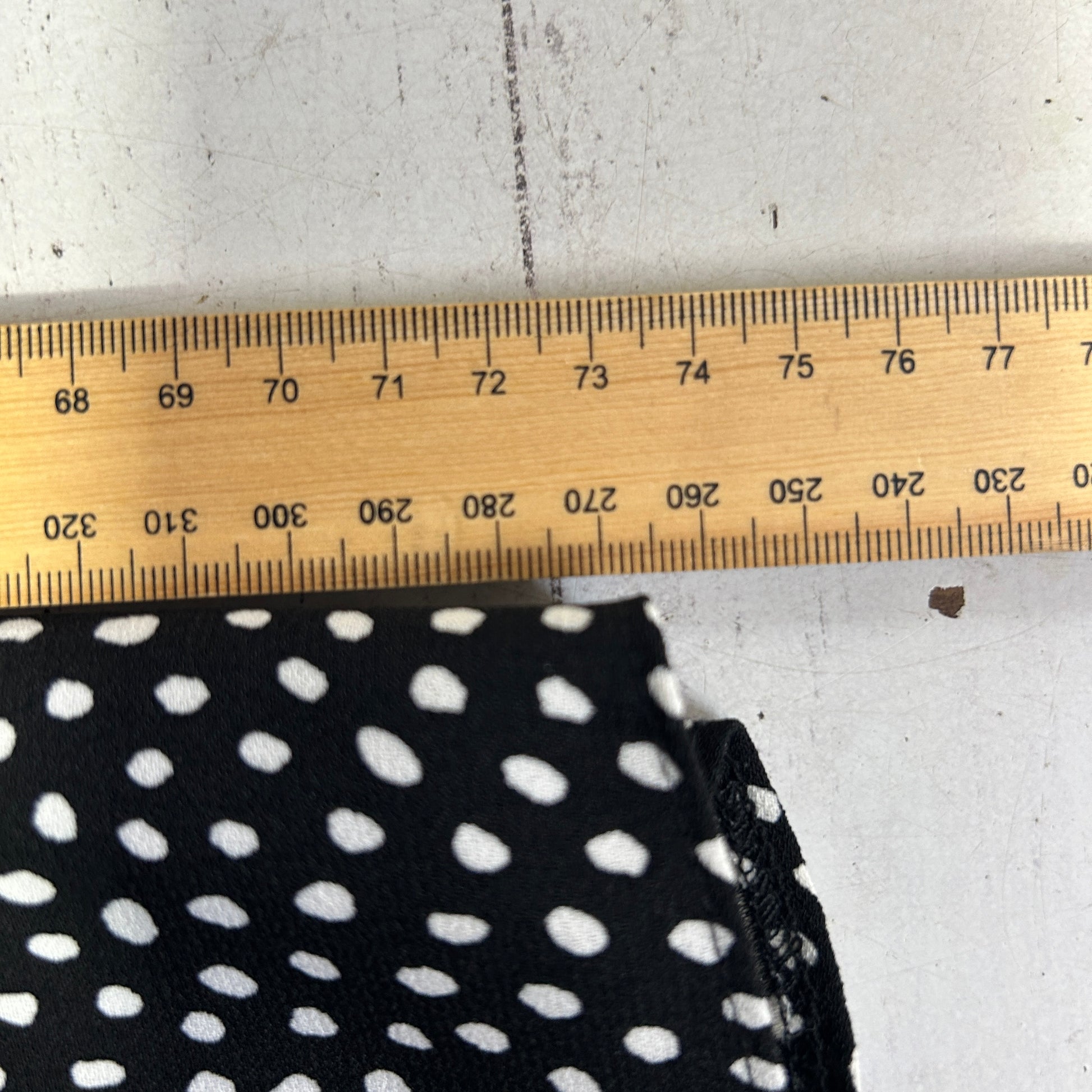 Black and white polka dot fabric detail view