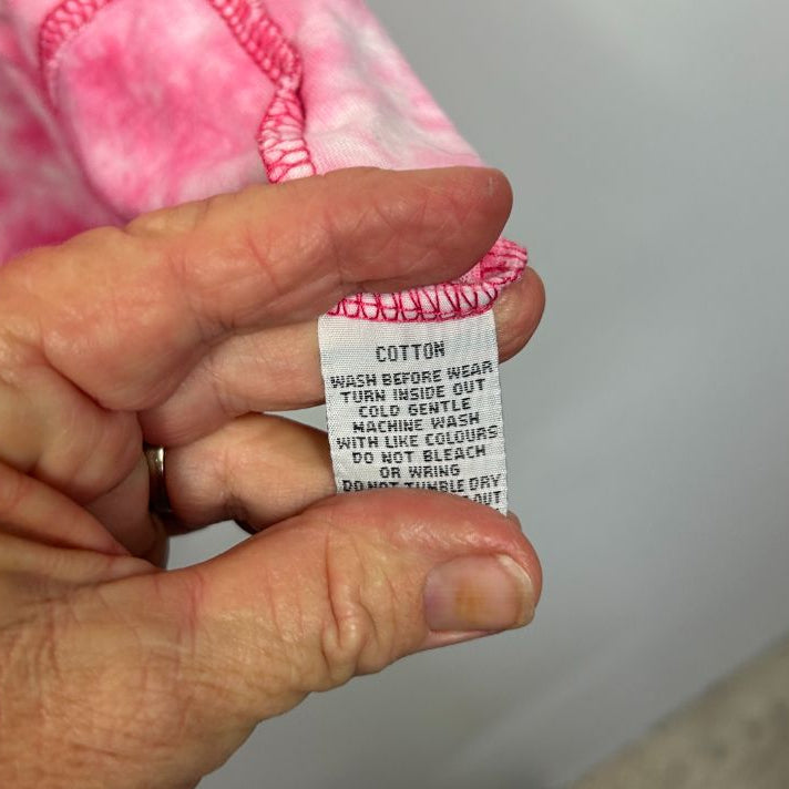 Pink tie dye top label detail view