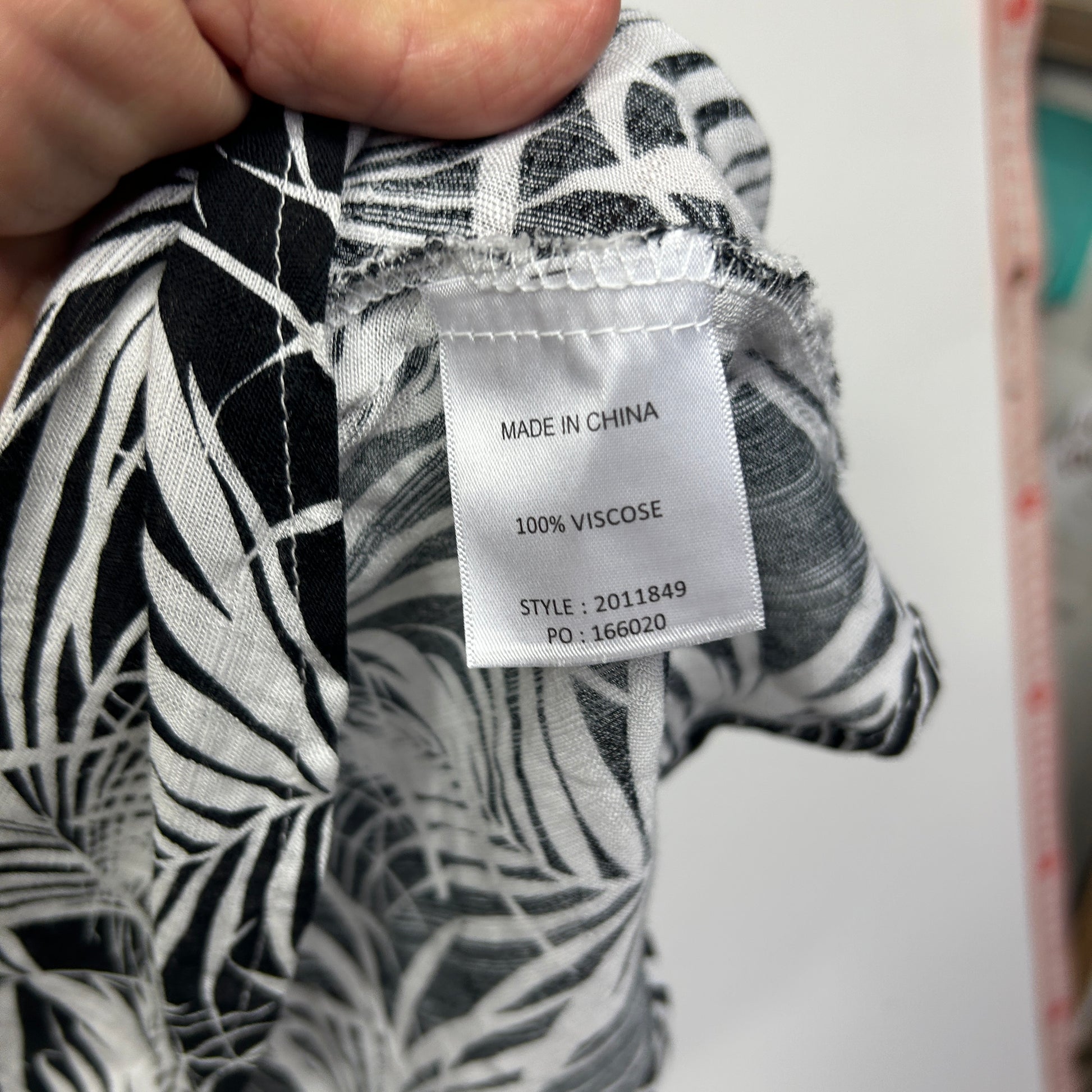 Black and white zebra print top label detail view