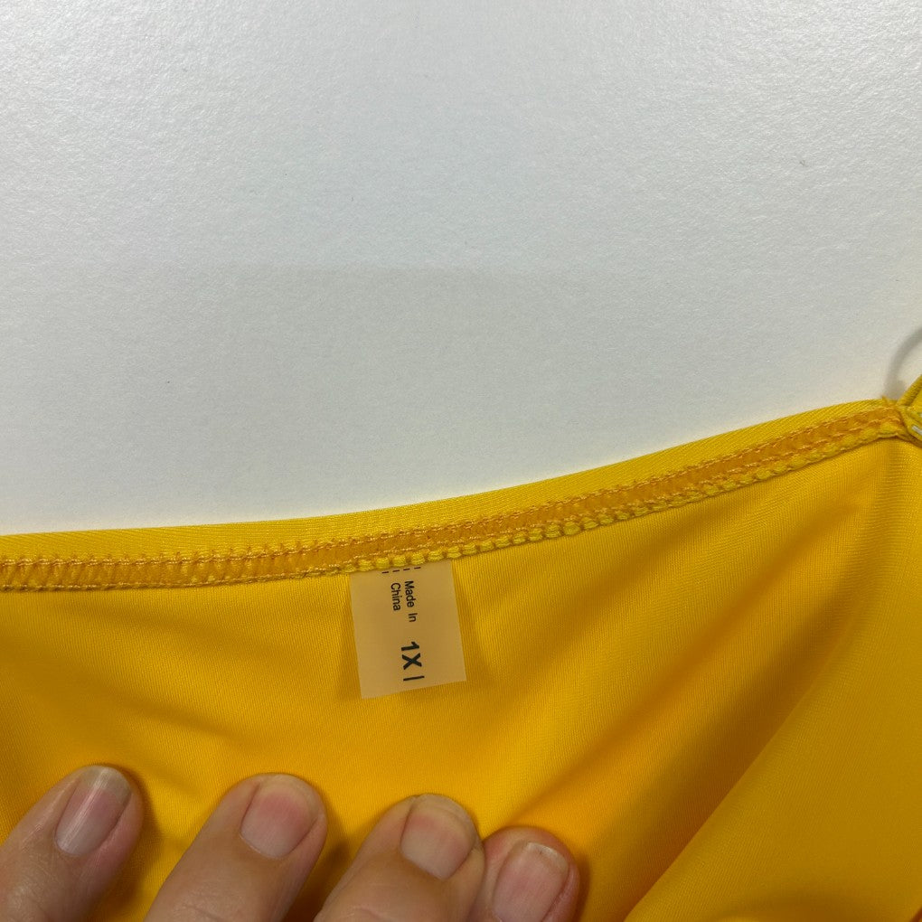 Yellow top label and neckline detail view