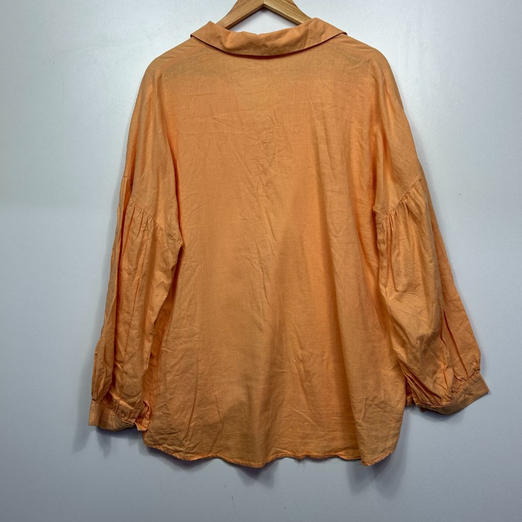Tan long sleeve shirt back view
