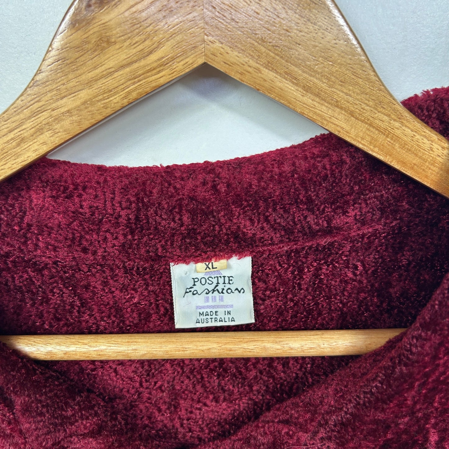 Burgundy jumper label detail view