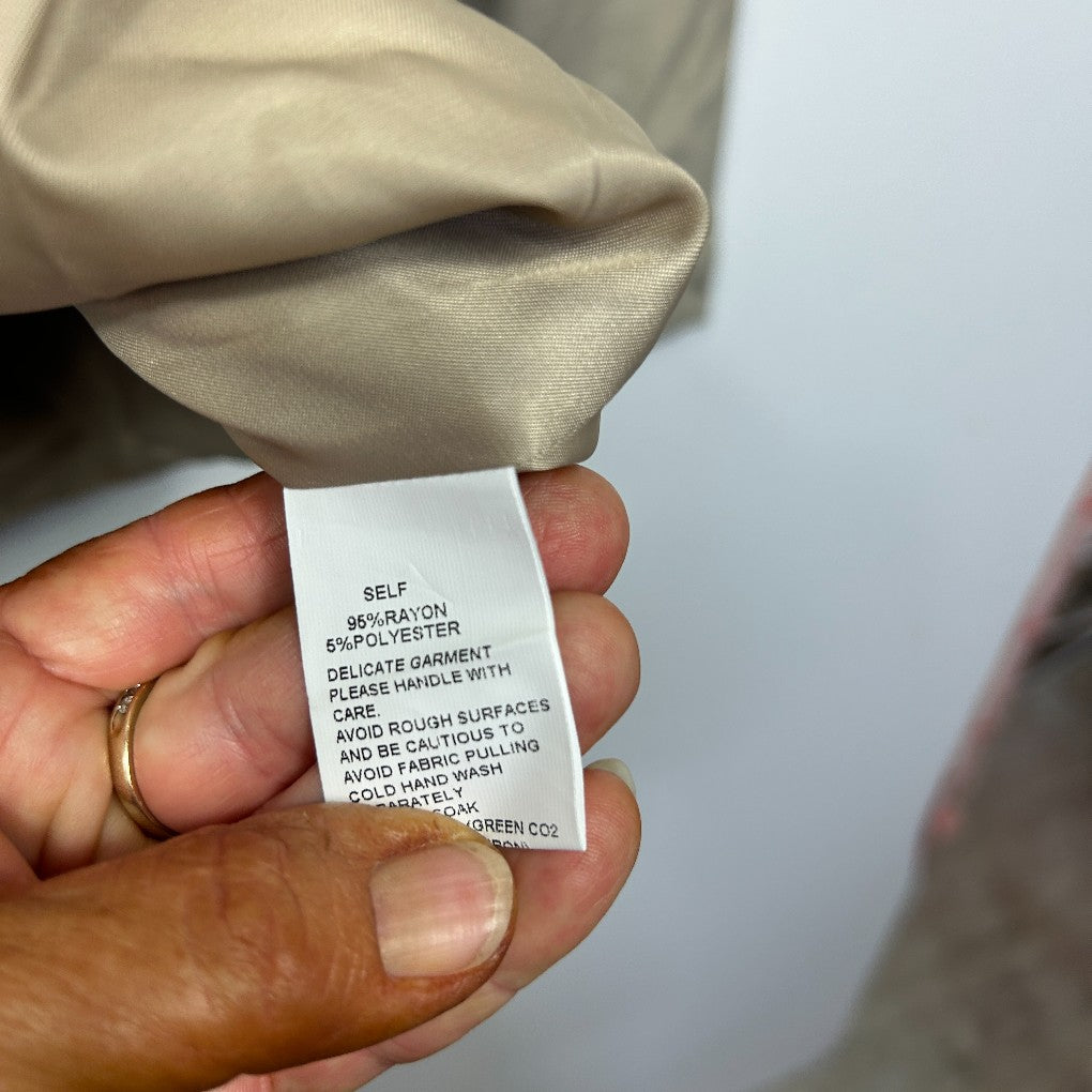 Beige garment label detail view