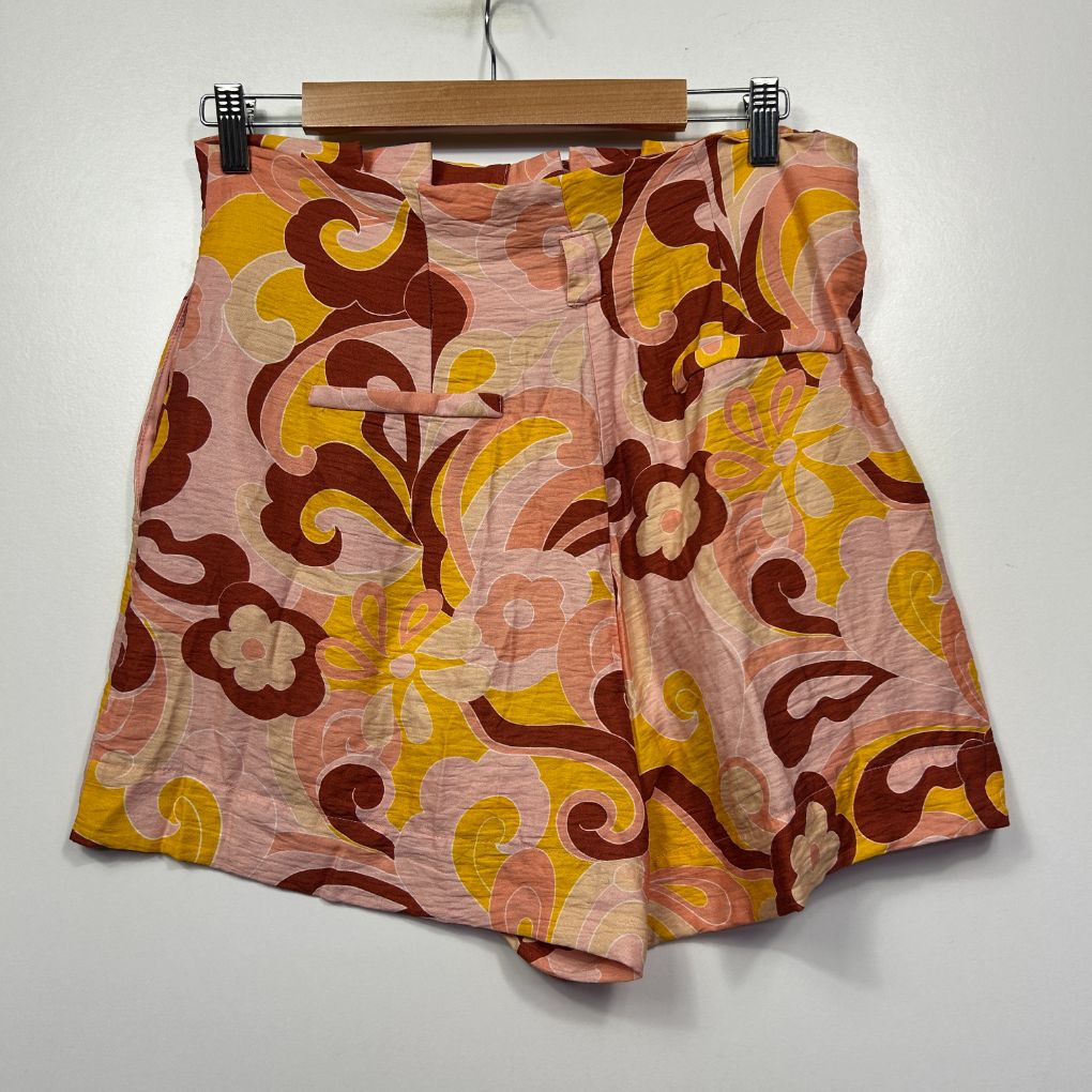 Pink shorts with burgundy and yellow floral pattern front view