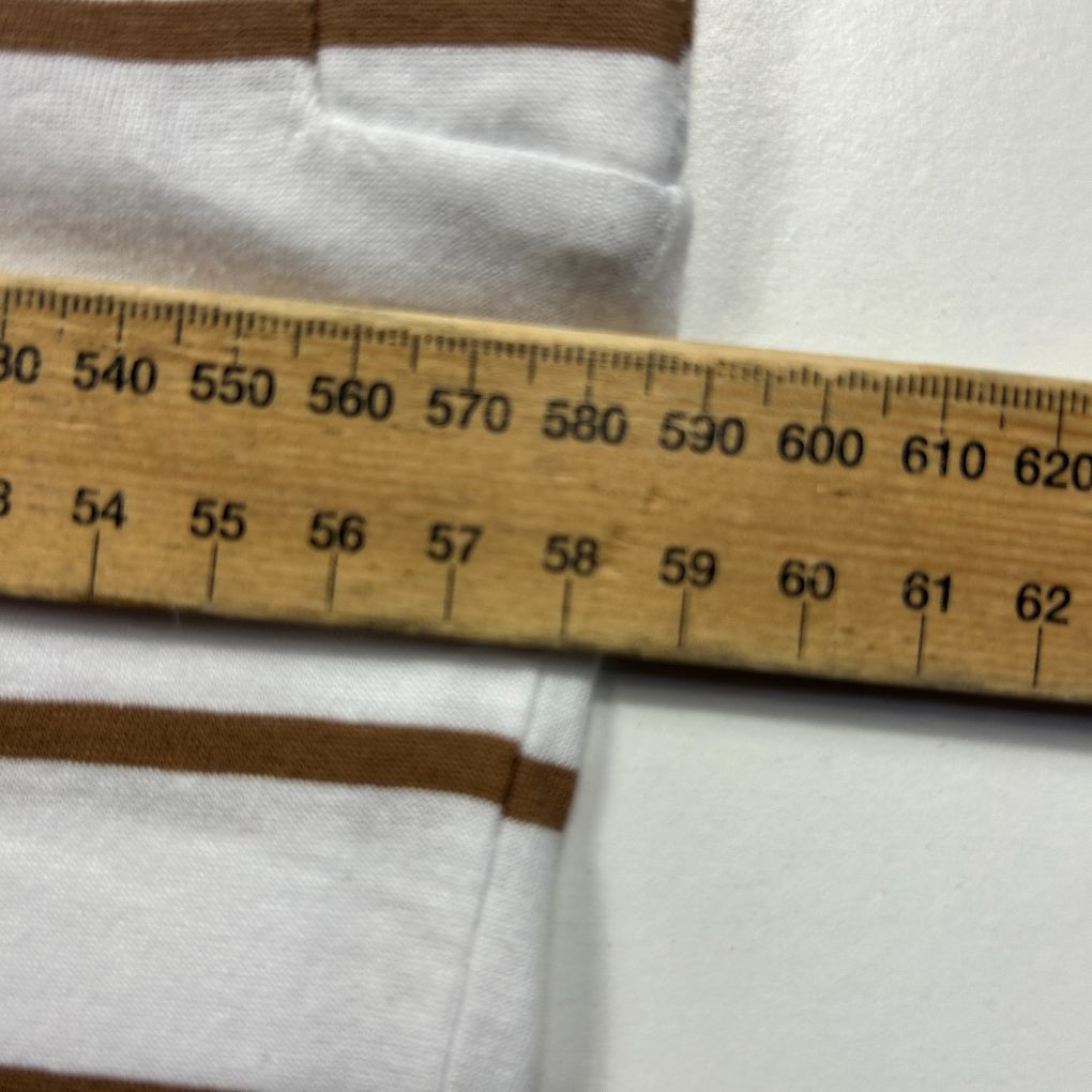 White fabric measurement detail view with ruler
