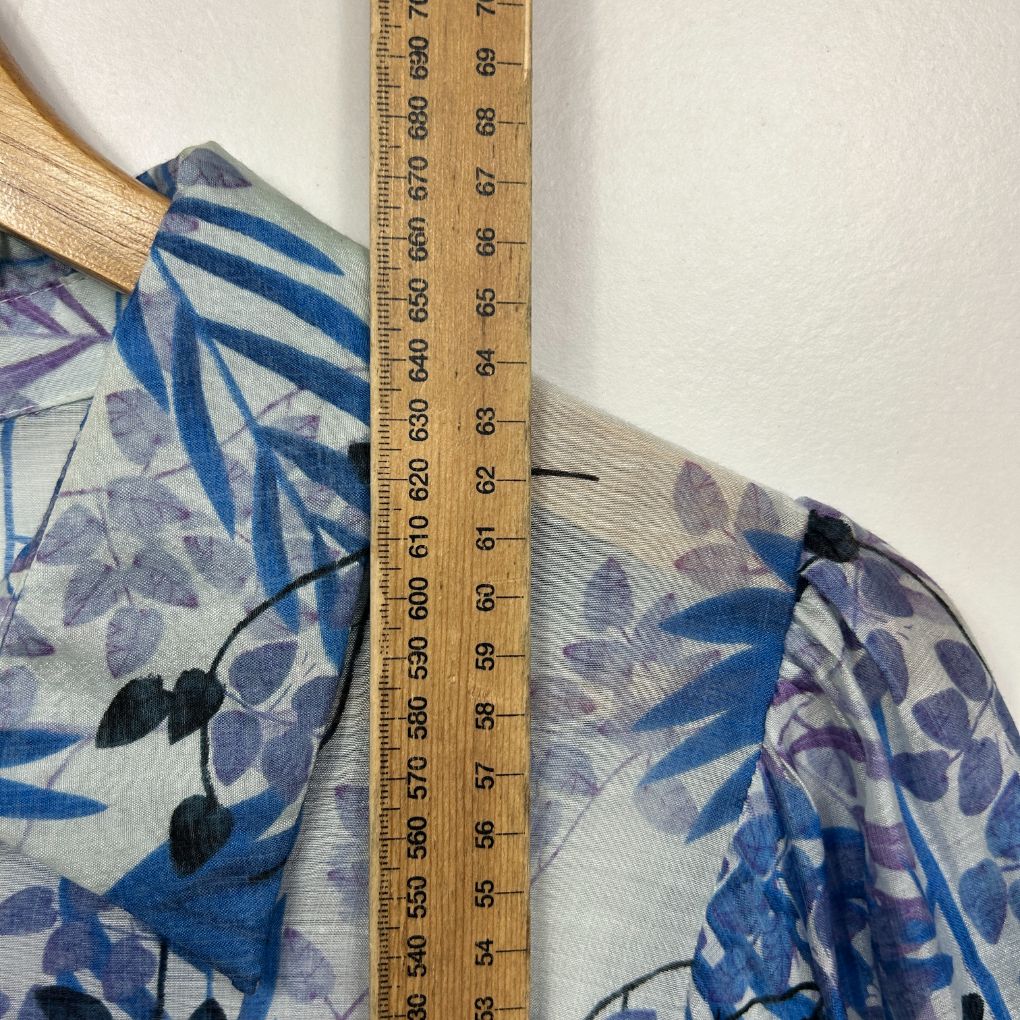 Blue and purple floral fabric detail view with measuring ruler