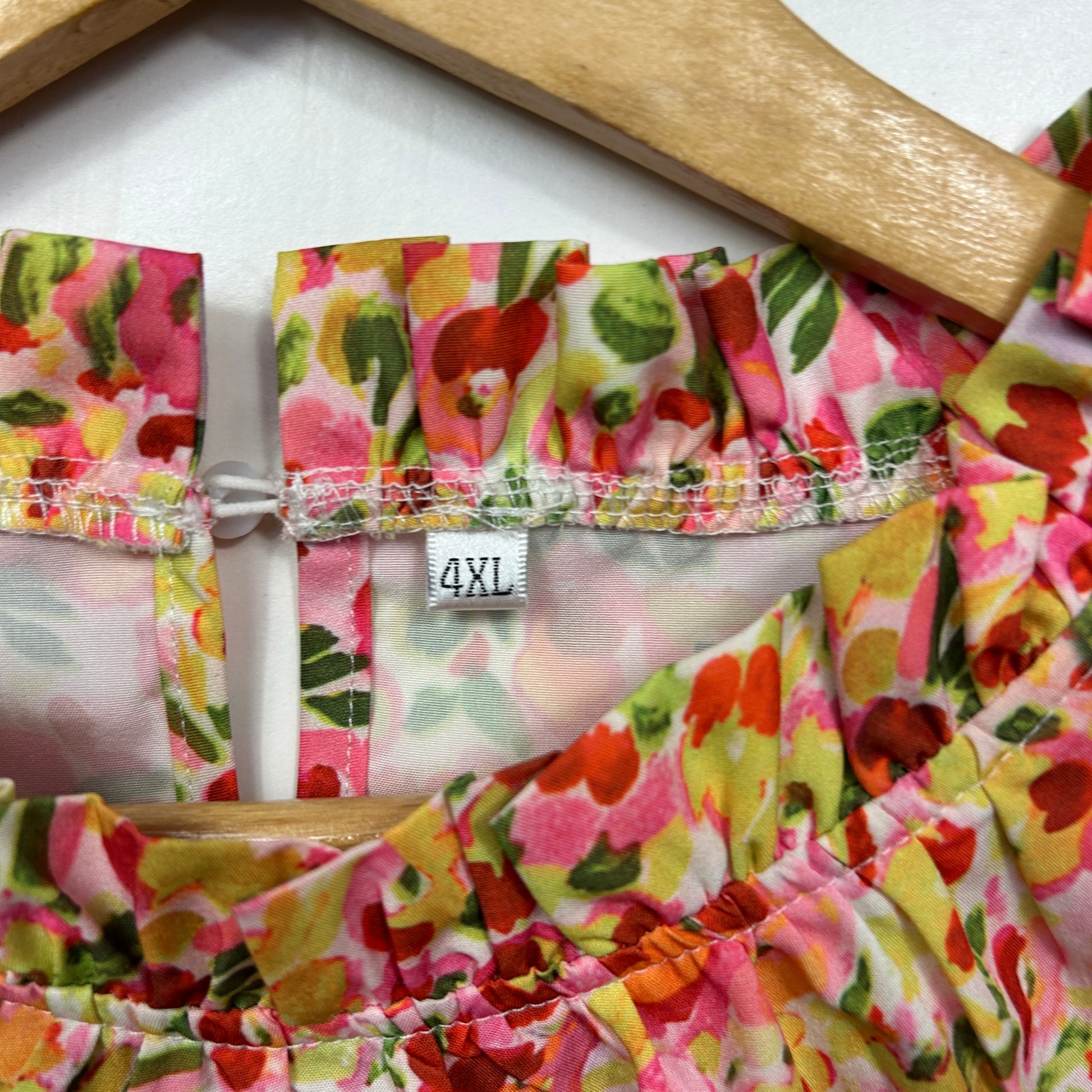 Floral dress detail view showing label and waistband