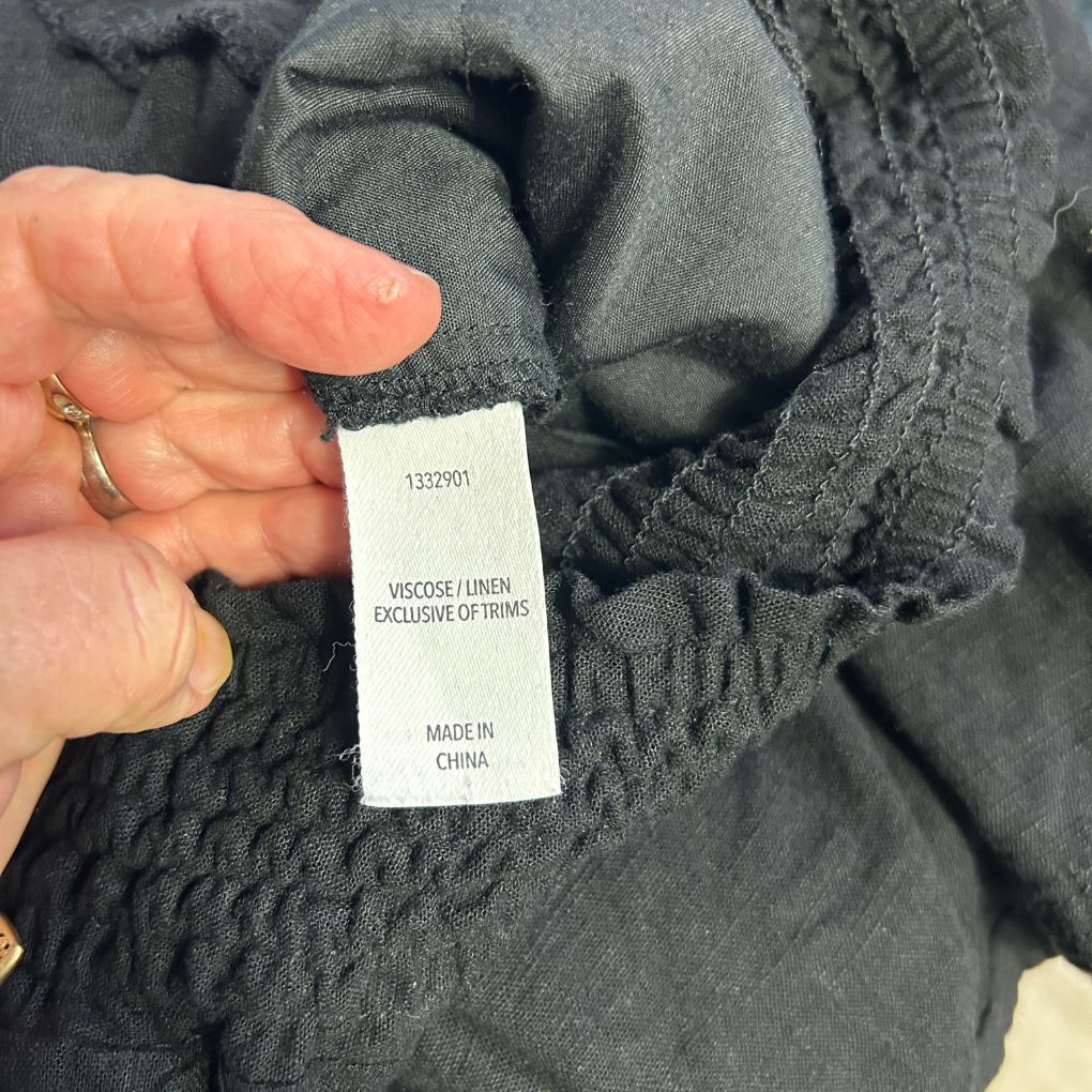 Grey garment label detail view