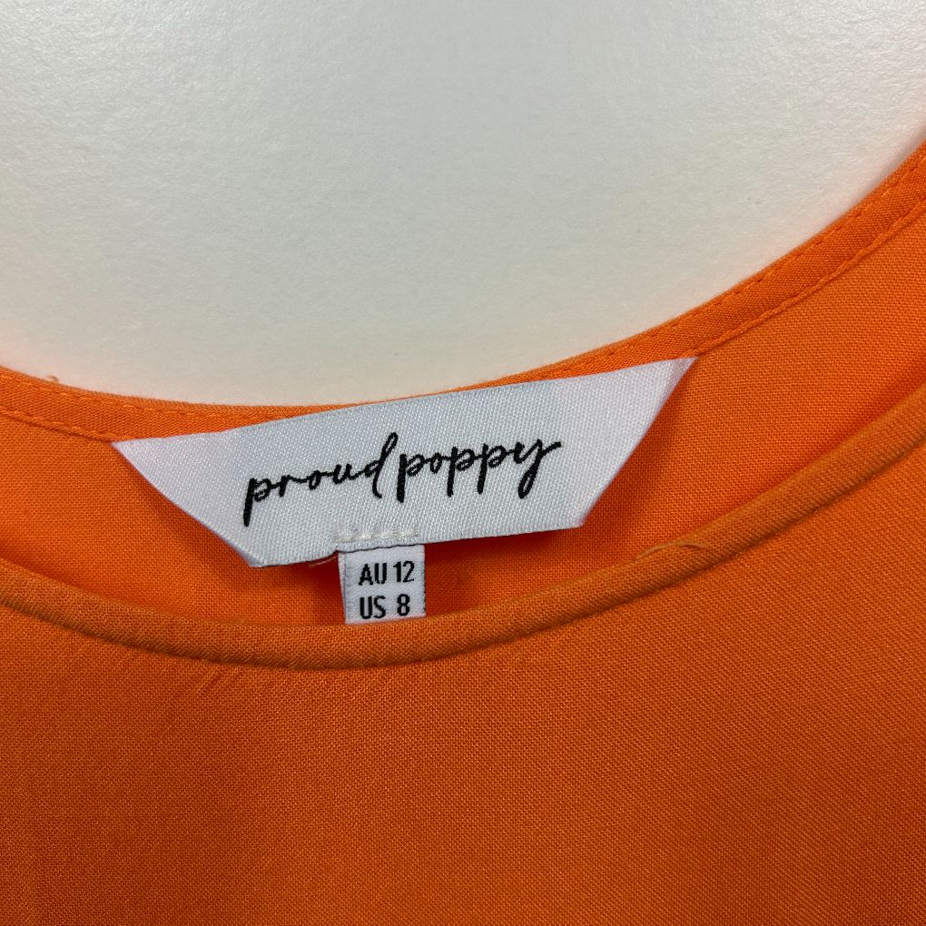 Orange t-shirt label detail view