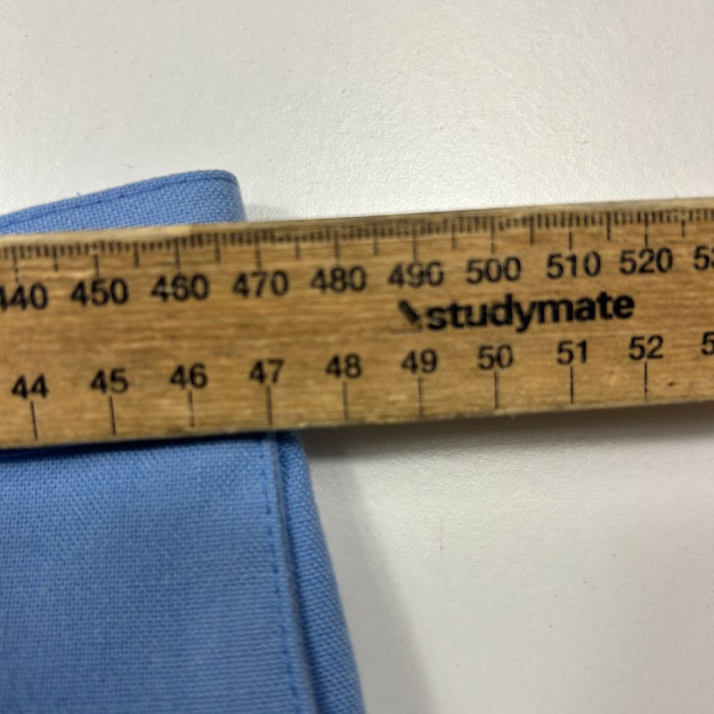 Blue fabric with measurement ruler detail view