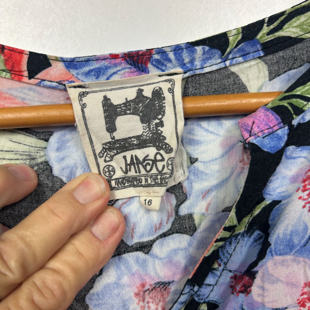 Floral dress label detail view showing size 16