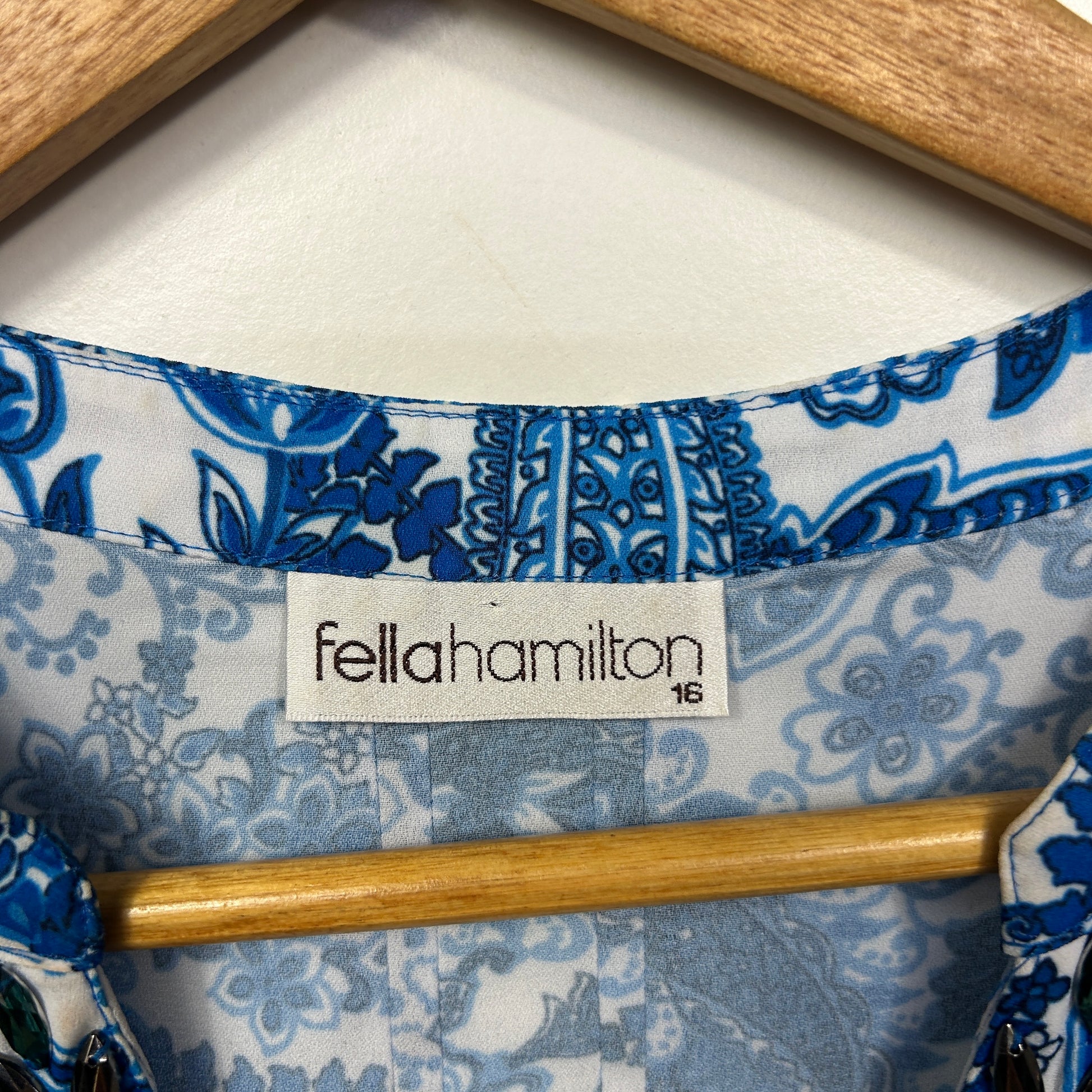 Blue and white floral blouse label and detail view