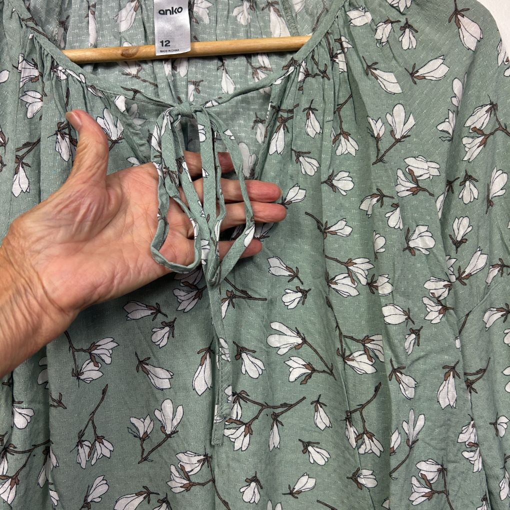 Sage green floral shirt front view