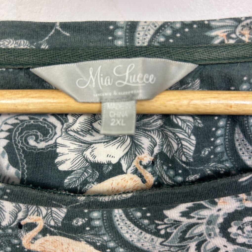 Mia Lucce label detail on dark patterned fabric