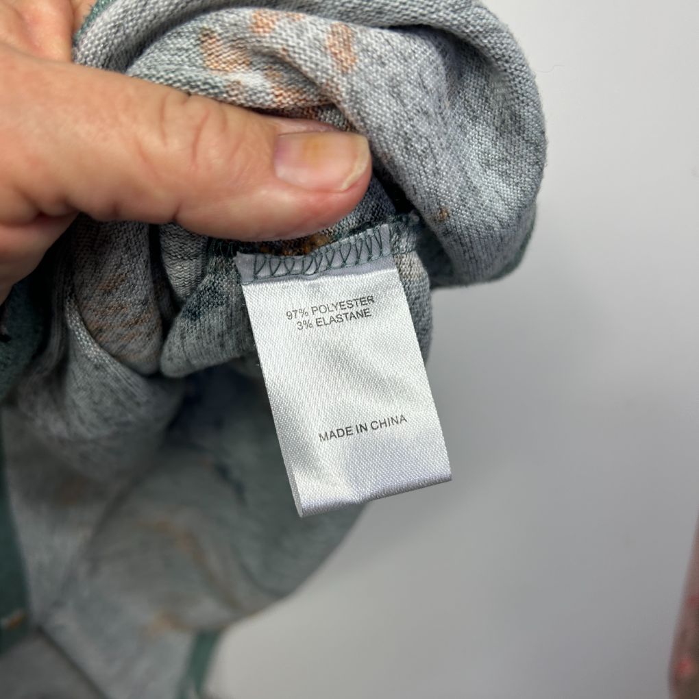 Grey knit garment label detail view
