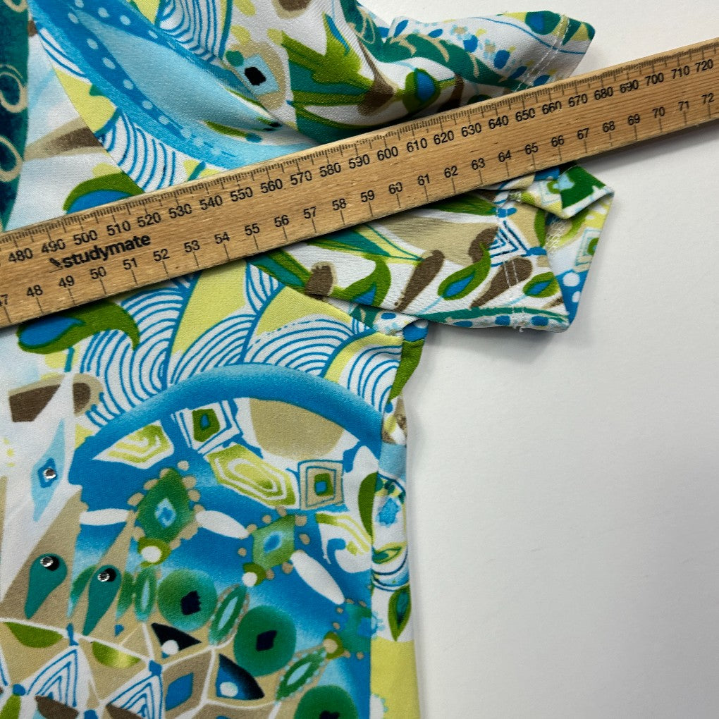 Blue and green graphic print fabric with measuring tape detail view