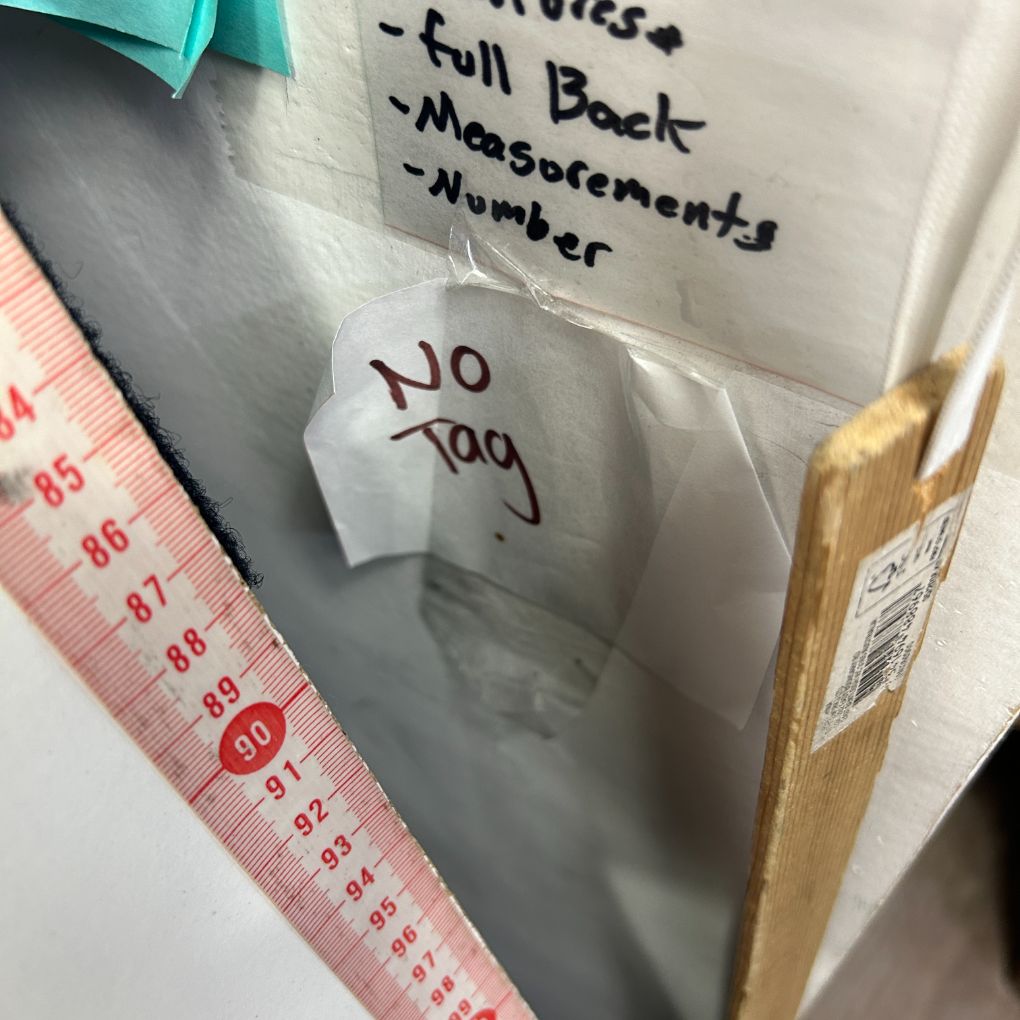 White garment storage bag detail view