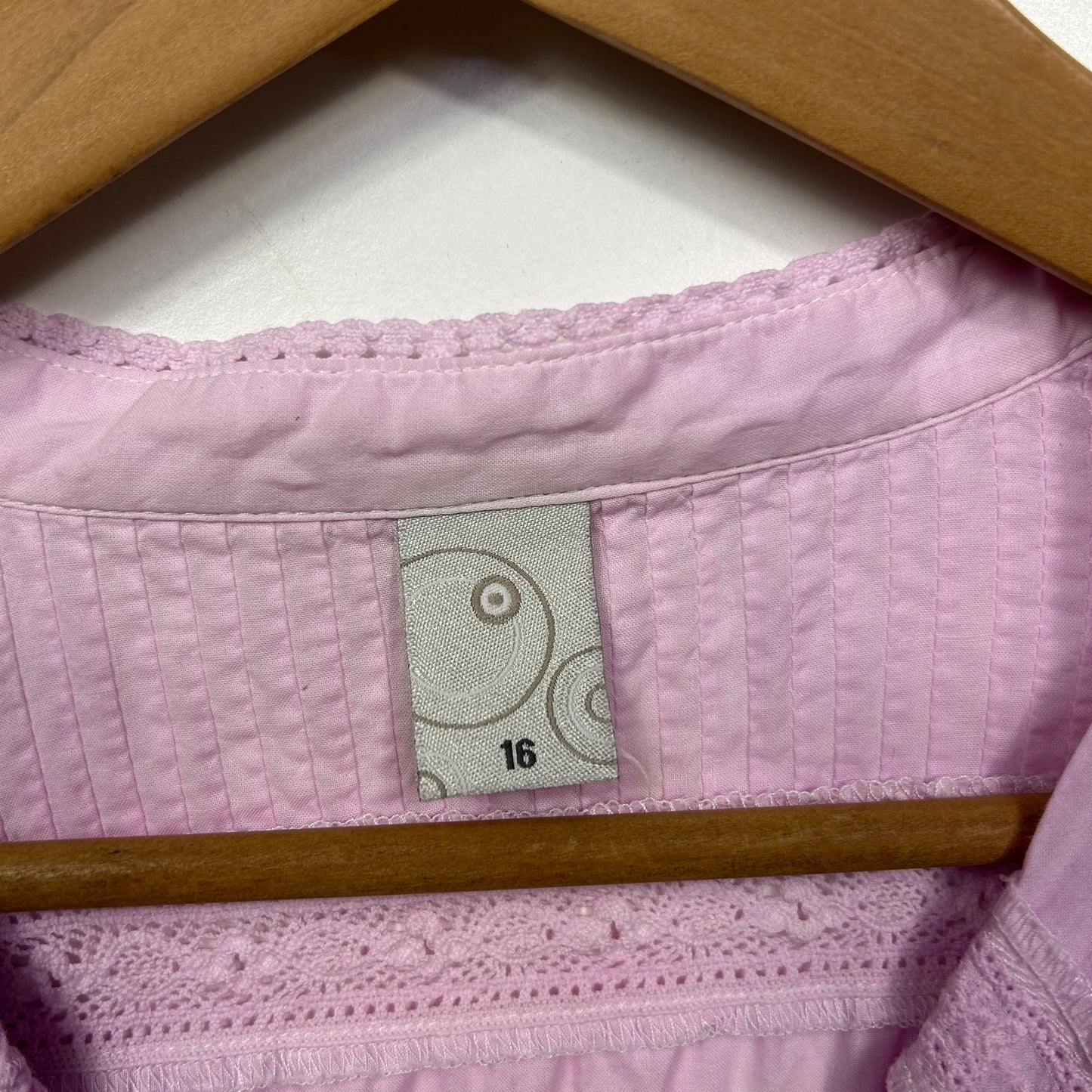Pink quilted shirt label and detail view