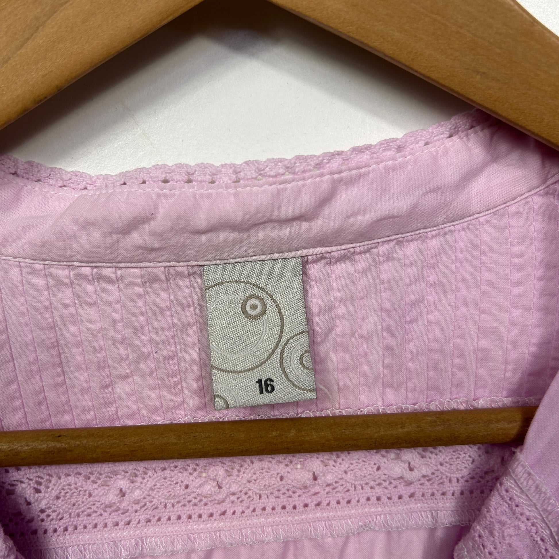 Pink quilted shirt label and detail view