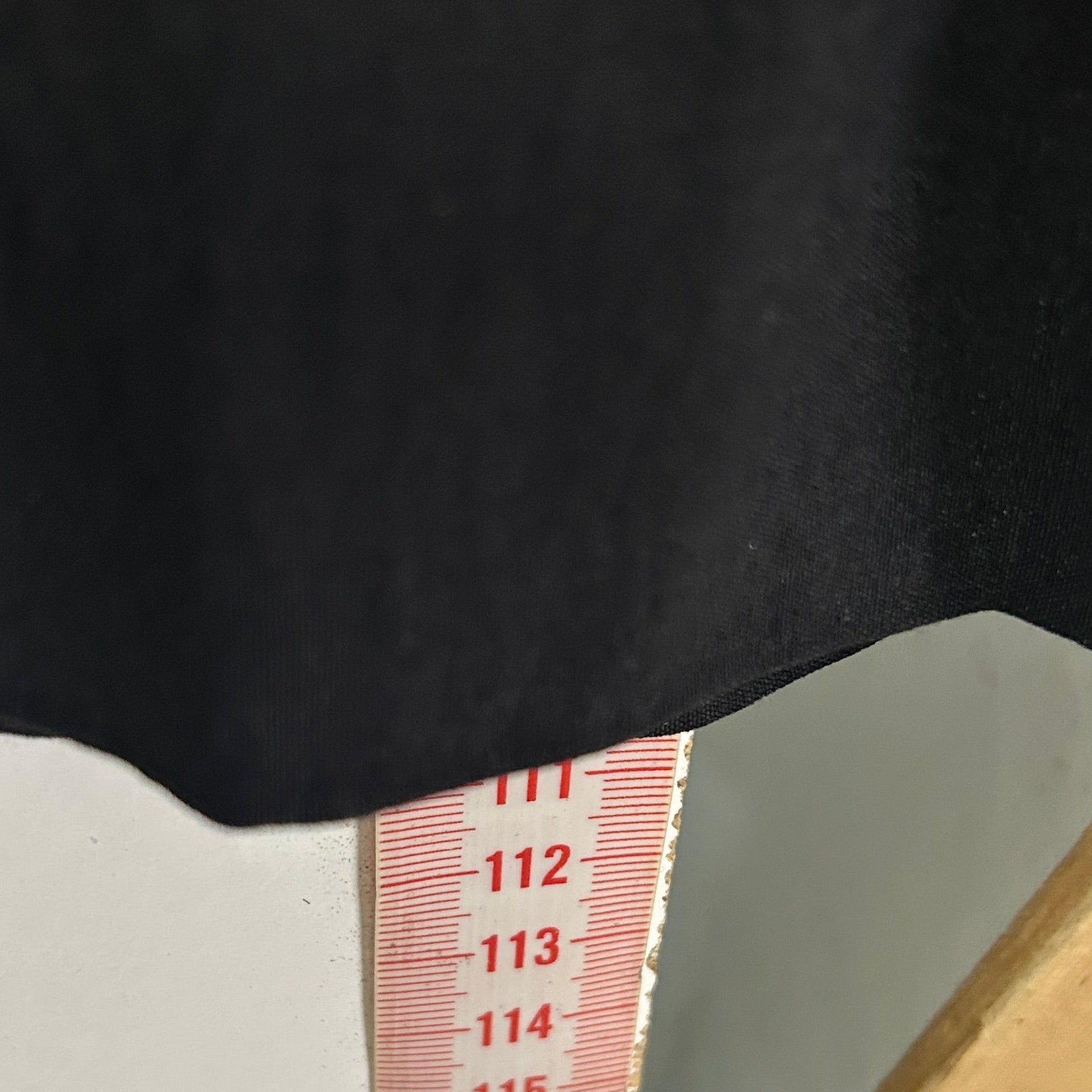 Black top with white cuff detail view