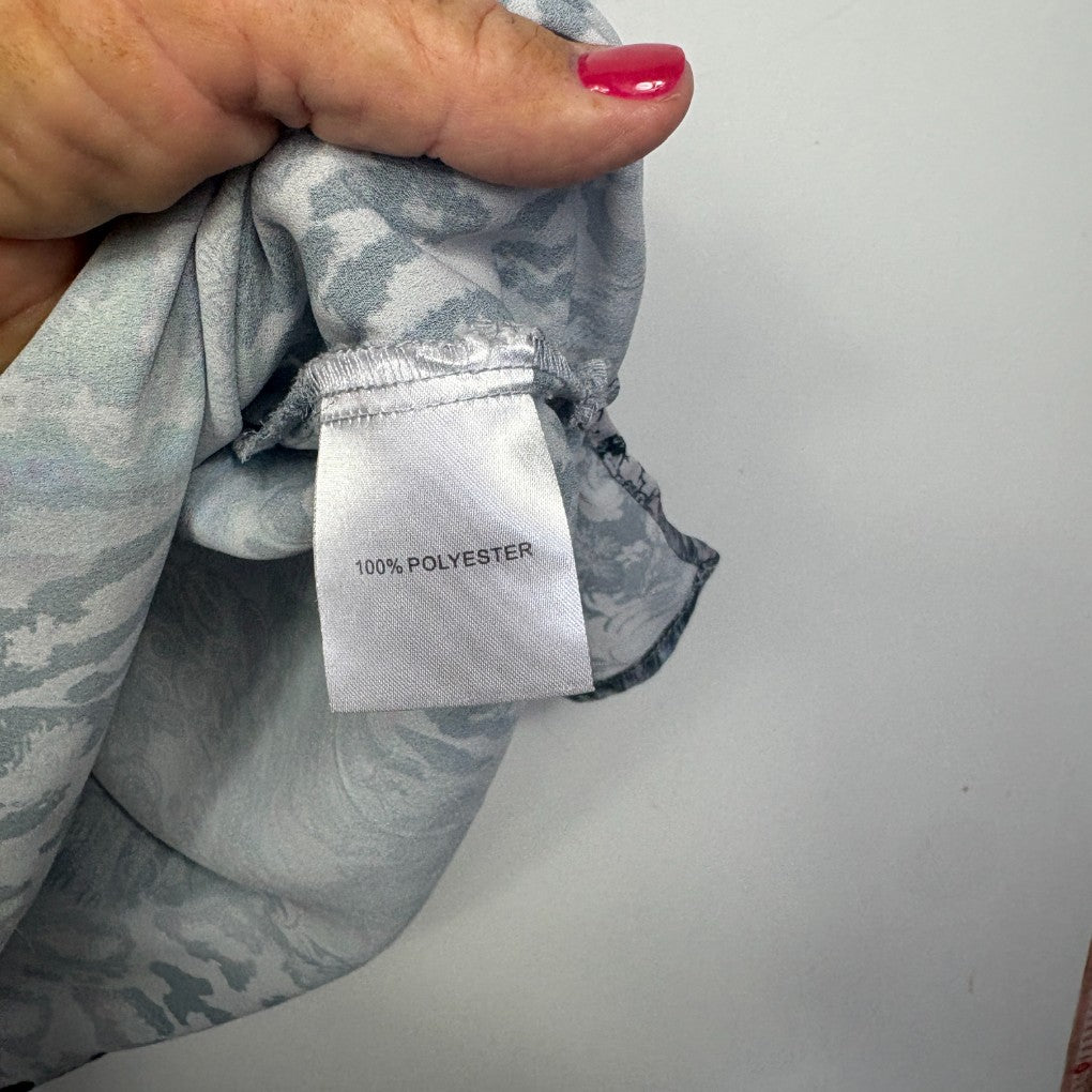 Grey polyester scarf detail view showing label