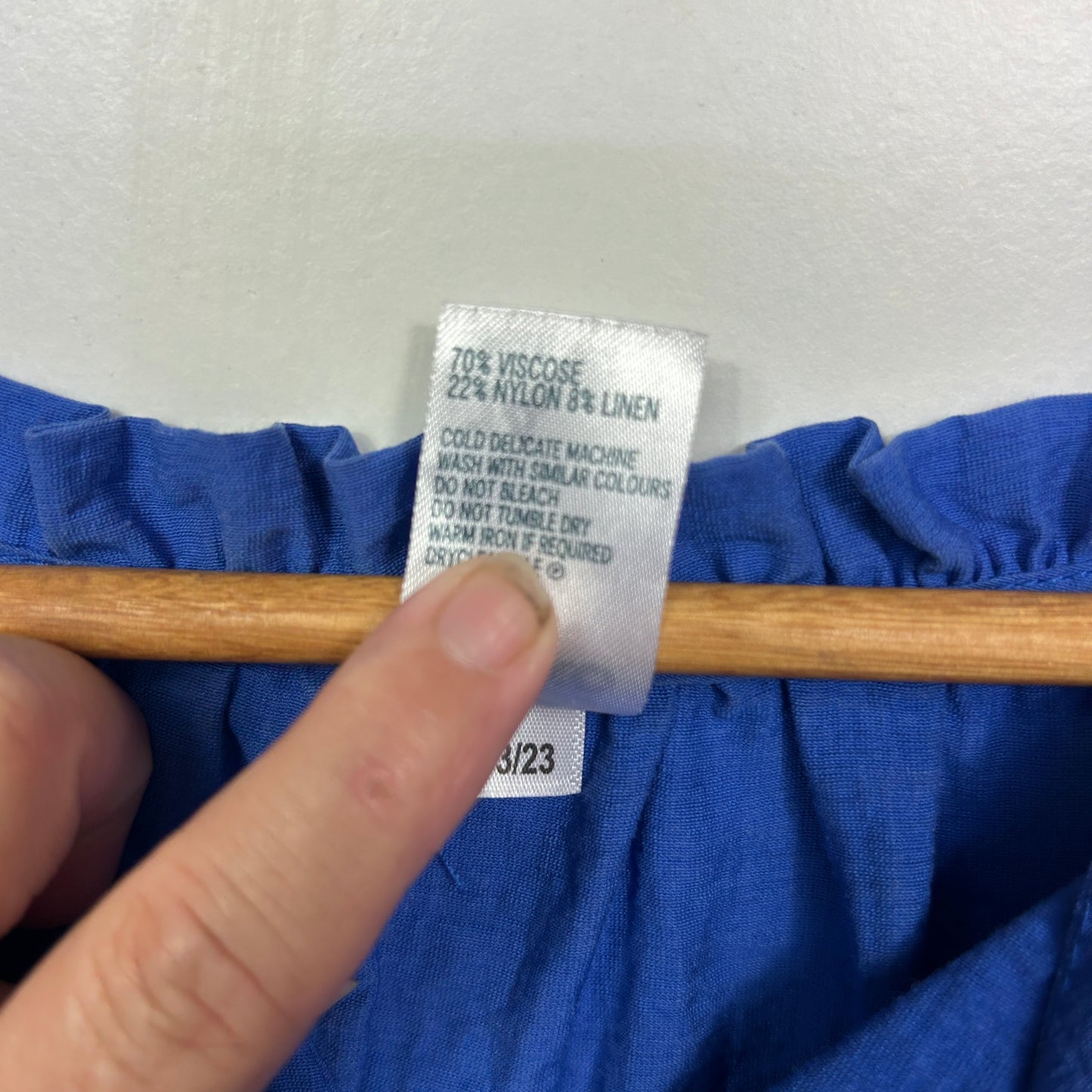 Blue garment label detail view