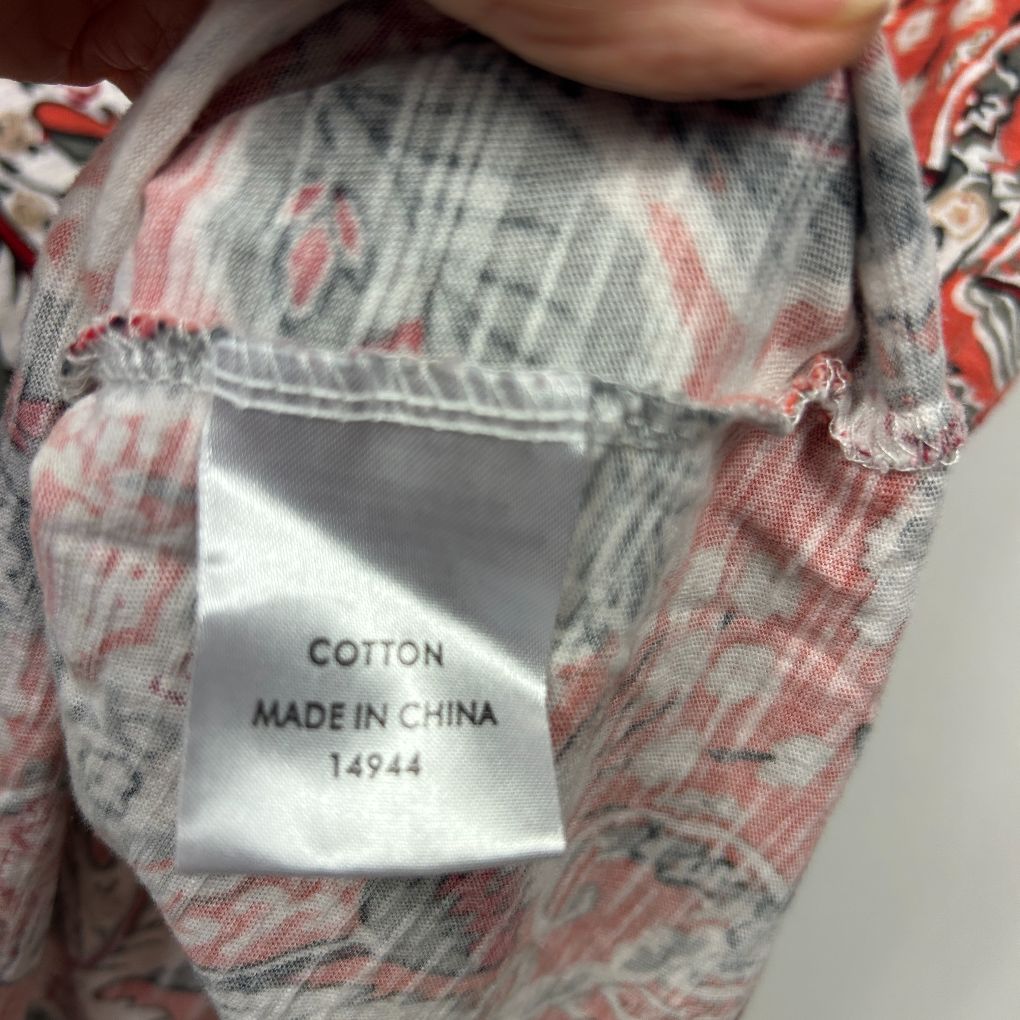 Red and grey floral shirt label detail view