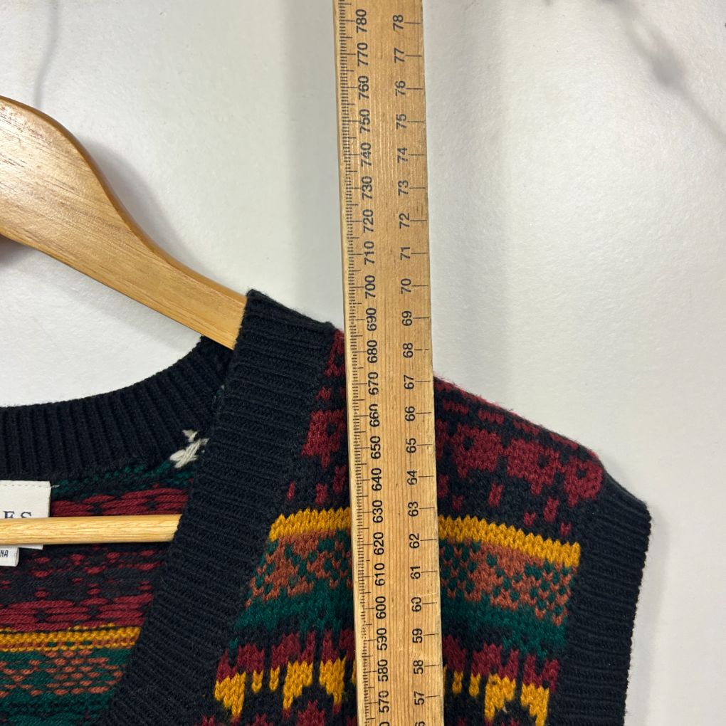 Black knit sweater with red yellow and green geometric pattern front view