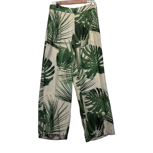 Green and cream tropical leaf print wide leg pants front view