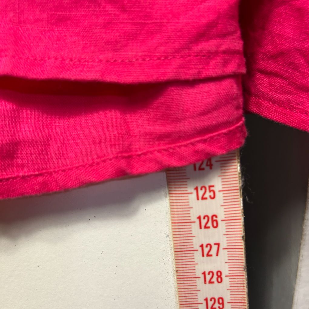 Pink top detail view with measurement scale