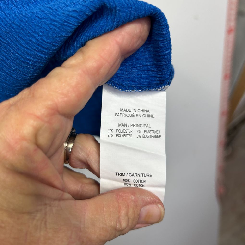 Blue garment label detail view