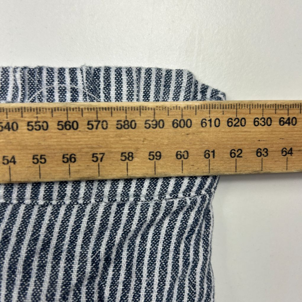 Navy and white striped fabric detail view with measuring tape